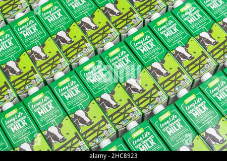 1 Litre paper carton units of ASDA own-label long-life UHT semi-skimmed milk. For British food produce, UK dairy industry, supply chain crisis UK. Stock Photo