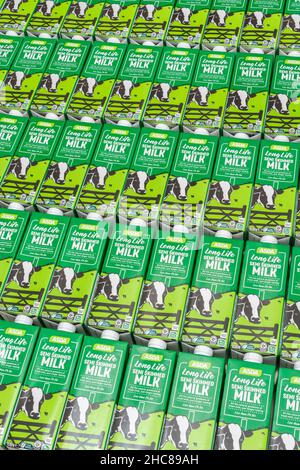 1 Litre paper carton units of ASDA own-label long-life UHT semi-skimmed milk. For British food produce, UK dairy industry, supply chain crisis UK. Stock Photo