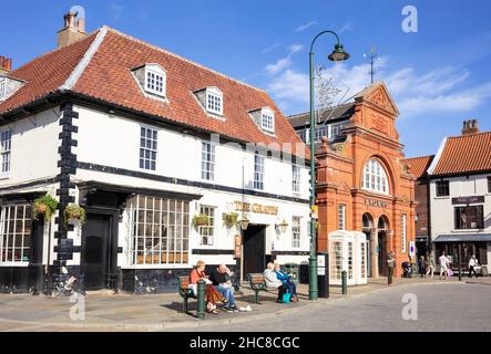 Browns Beverley department store The grapes pub and white telephone boxes in the Market town of Beverley Yorkshire East Riding of Yorkshire England UK Stock Photo