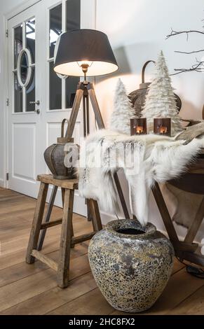 Still life with reindeer fur and winter Christmas themed living room decoration. Stock Photo
