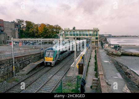 Blackrock, Dublin, Ireland, November 12, 2021: An Irish Rail Ianrod Eireann class 22000 on a service from Wexford passing through Blackrod station Stock Photo