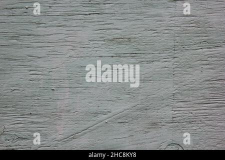 Old weathered and worn wood plank painted a light grey. Stock Photo