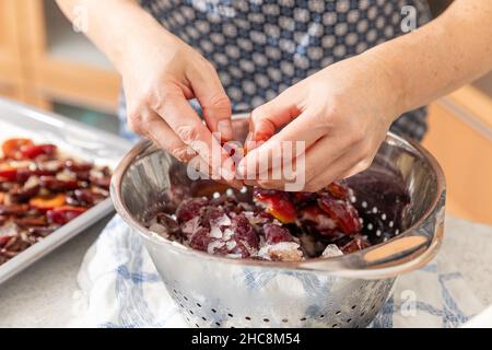 Baking plum cake in the kitchen Stock Photo