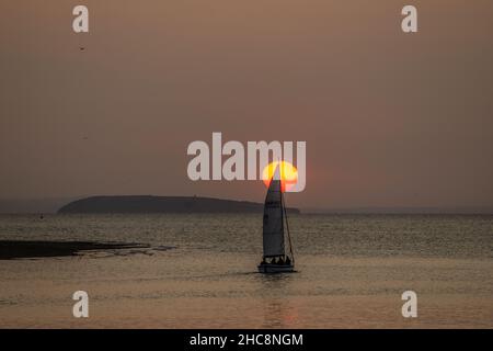 Sunset with yacht, Deganwy, North Wales Stock Photo