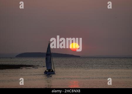 Sunset with yacht, Deganwy, North Wales Stock Photo