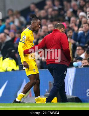 Crystal Palace's Wilfried Zaha (left) reacts after being sent off during the Premier League match at the Tottenham Hotspur Stadium, London. Picture date: Sunday December 26, 2021. Stock Photo