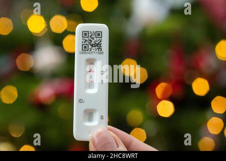 woman does a lateral flow test for coronavirus at home. Stock Photo