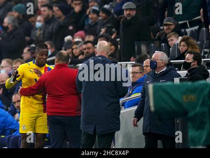 Crystal Palace's Wilfried Zaha (left) reacts after being sent off during the Premier League match at the Tottenham Hotspur Stadium, London. Picture date: Sunday December 26, 2021. Stock Photo