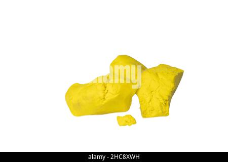Plasticine children material education, yellow clay for kids isolated on white background. Stock Photo