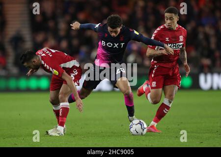 MIDDLESBROUGH, UK. DEC 26TH Nottingham Forest's Brennan Johnson in action with Middlesbrough's Neil Taylor and Marcus Tavernier during the Sky Bet Championship match between Middlesbrough and Nottingham Forest at the Riverside Stadium, Middlesbrough on Sunday 26th December 2021. (Credit: Mark Fletcher | MI News) Credit: MI News & Sport /Alamy Live News Stock Photo