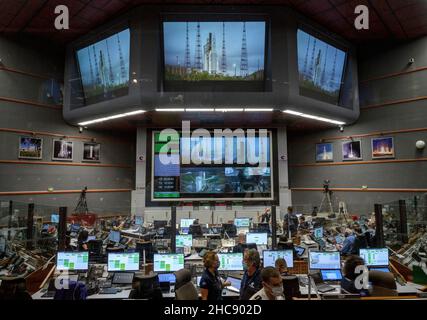 Kourou, French Guiana. 25 December, 2021. Launch teams monitor the countdown to the launch of the Arianespace Ariane 5 rocket with the NASA James Webb Space Telescope onboard, in mission control at the Guiana Space Center, December 25, 2021 in Kourou, French Guiana.  Credit: Bill Ingalls/NASA/Alamy Live News