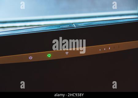 Home internet wifi router and backlit indicators, closeup Stock Photo