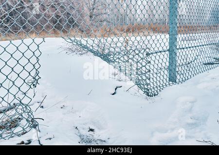 Hole in wire border fence. Stock Photo