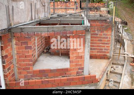 House under construction with its columns and walls recently built. Stock Photo