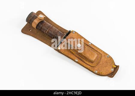 Vintage hunting knife with leather sheath and sharpening stone. Stock Photo