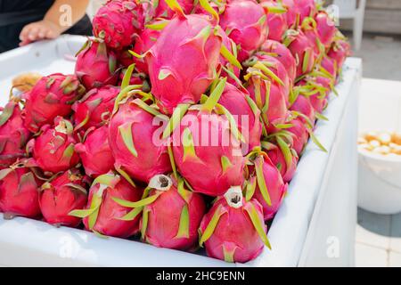 Dragon fruit on a market stall at farmers summer fair Stock Photo