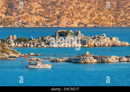 Kekova Island with its famous sunken city is one of the most popular destinations in Turkey attracts many travelers on boat tours and sea cruise ships Stock Photo