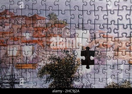 Jigsaw puzzle background, one last piece missing only. Almost finished, solution, and complete task concept. Stock Photo