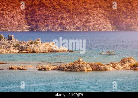 Kekova Island with its famous sunken city is one of the most popular resorts in Turkey attracts many travelers on boat tours and sea cruise ships. Idy Stock Photo