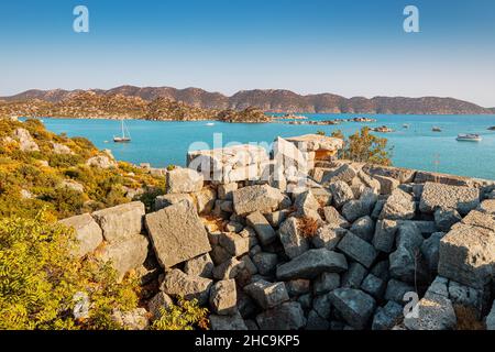 Famous Simena ancient castle on a top of a hill with Turkish flag. Travel and tourist attractions at Kekova island Stock Photo