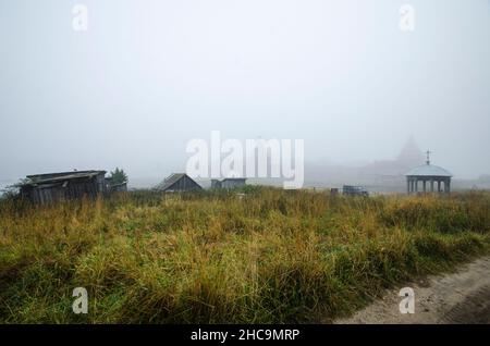 View of the Solovetsky Monastery in the fog. Fortress over water Stock Photo
