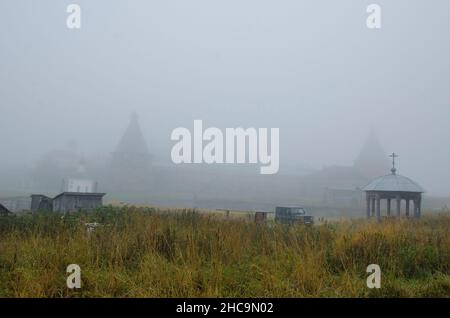 View of the Solovetsky Monastery in the fog. Fortress over water Stock Photo
