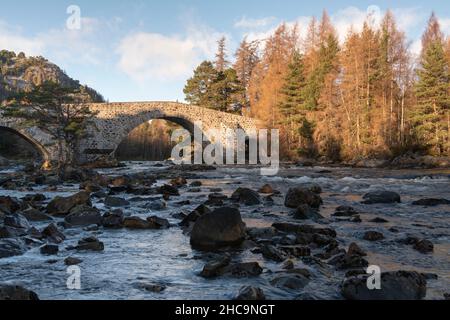 A Scenic View of the River Dee & the Hump-backed Bridge at Invercauld, near Braemar, on a Winter Morning on Royal Deeside in the Scottish Highlands Stock Photo