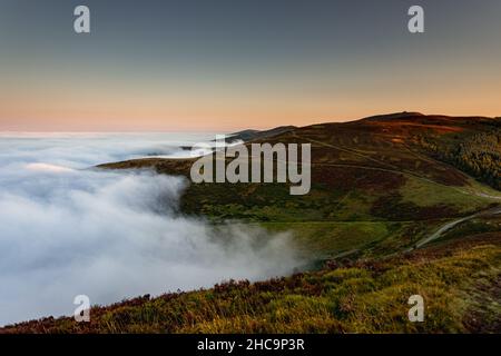 Clwydian Range in fog at sunrise, North Wales Stock Photo