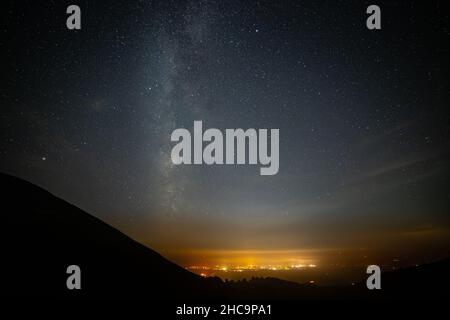 Milky way over Ruthin in the Vale of Clwyd, North Wales Stock Photo