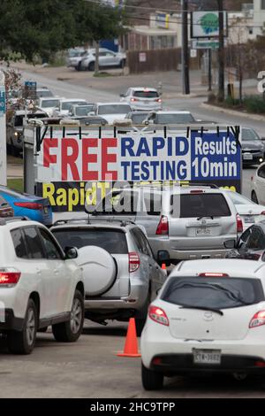Austin, Texas, USA. 26th December, 2021. A mobile private COVID testing site that saw little traffic in November is overwhelmed in late December with Austin, TX USA residents wanting to get tested for the omicron variant during the holidays. Patrons reported up to three-hour waits at the drive-through site, one of several opened over the Christmas holidays. Credit: Bob Daemmrich/Alamy Live News Stock Photo