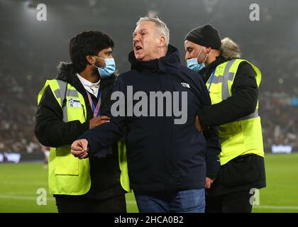 London, England, 26th December 2021.  A pitch invader is escorted off the pitch during the Premier League match at the London Stadium, London. Picture credit should read: Jacques Feeney / Sportimage Credit: Sportimage/Alamy Live News Stock Photo