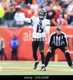 Cincinnati, United States. 26th Dec, 2021. Cincinnati Bengals quarterback  Joe Burrow (9) runs for the first down under pressure from Baltimore Ravens  defense during the first half of play at Paul Brown