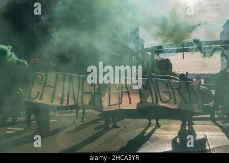 Seattle, USA. 25th Sep, 2021. Late in the day protestors setting off smoke grenades at the Chinga La Migra Anti-Ice march. Stock Photo