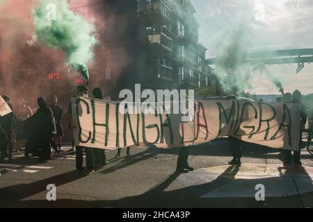 Seattle, USA. 25th Sep, 2021. Late in the day protestors setting off smoke grenades at the Chinga La Migra Anti-Ice march. Stock Photo