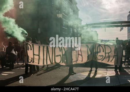 Seattle, USA. 25th Sep, 2021. Late in the day protestors setting off smoke grenades at the Chinga La Migra Anti-Ice march. Stock Photo