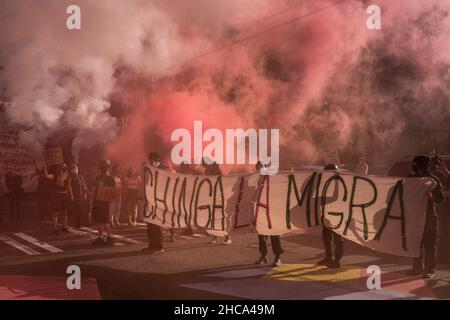 Seattle, USA. 25th Sep, 2021. Late in the day protestors setting off smoke grenades at the Chinga La Migra Anti-Ice march. Stock Photo