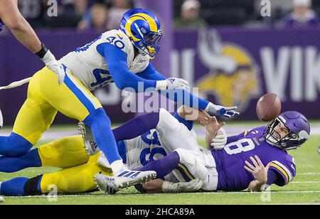 Minneapolis, United States. 26th Dec, 2021. Minnesota Vikings quarterback Kirk Cousins (8) fumbles the ball, which was recovered by Vikings offensive tackle Christian Darrisaw (71), in the fourth quarter against the Los Angeles Rams, Sunday, Dec. 26, 2021 at U.S. Bank Stadium in Minneapolis. (Photo by Elizabeth Flores/Minneapolis Star Tribune/TNS/Sipa USA) Credit: Sipa USA/Alamy Live News Stock Photo