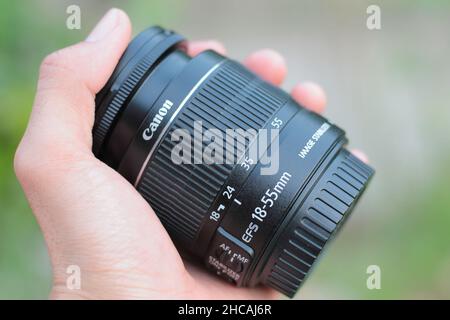 a black canon brand dslr kit lens made of plastic Stock Photo