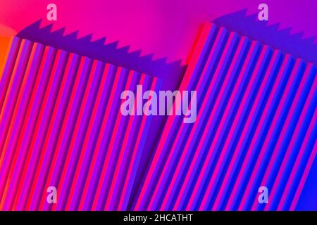 Pink and violet background with lines. Abstract neon background with gradient and stripes. Stock Photo