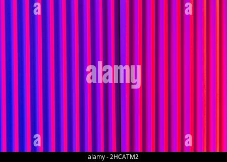 Pink and violet background with lines. Abstract neon background with gradient and stripes. Stock Photo