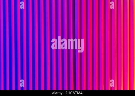Pink and violet background with lines. Abstract neon background with gradient and stripes. Stock Photo