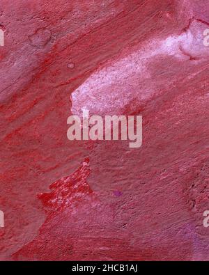 Beautiful dense background of heterogeneous burgundy pink crimson color. Texture of wallpaper, paint, finishing material, silk or velvet fabric in dar Stock Photo