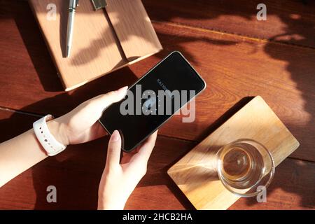 hands of woman scanning fingerprint on smartphone to get access Stock Photo