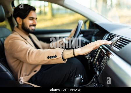 Man Using Gps Navigation System In Car to travel Stock Photo