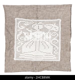 empty handcrafted linen pillowcase with vintage embroidery of lady with umbrella handmade by mesh filet crochet technique isolated on white background Stock Photo