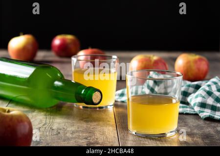 Apple cider drink on rustic wooden table Stock Photo