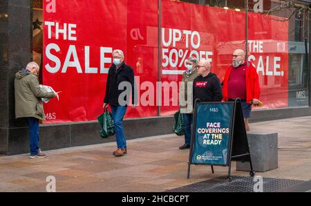 Boxing Day Sales in Preston, Lancashire.  UK Business. 26 December, 2021 Scarcity of Sale shoppers ahead of Covid announcment in Preston. Muted reaction to Post Christmas fashion Sales as bargain hunters stay away from the city centre.  New measures have already come into force in Scotland, Wales and Northern Ireland but ministers have so far swerved dictating new rules to those in England, instead hoping warnings would encourage people to self-police their own behaviour and cut down on social contacts. Credit; MediaWorldImages/AlamyLiveNews Stock Photo