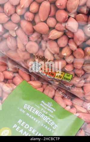 Packet of Morrison's supermarket own-label redskin peanuts. For own label brands, dietary traffic light label, plastic packaging. Stock Photo