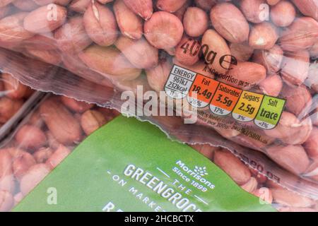 Packet of Morrison's supermarket own-label redskin peanuts. For own label brands, dietary traffic light label, plastic packaging. Stock Photo