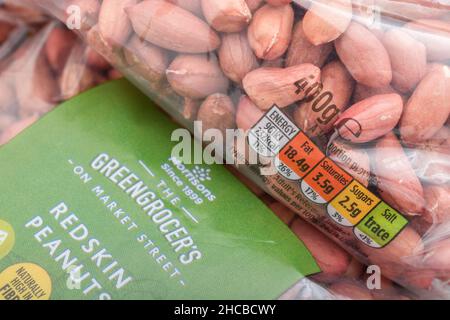 Packet of Morrison's supermarket own-label redskin peanuts. For own label brands, dietary traffic light label, plastic packaging. Stock Photo